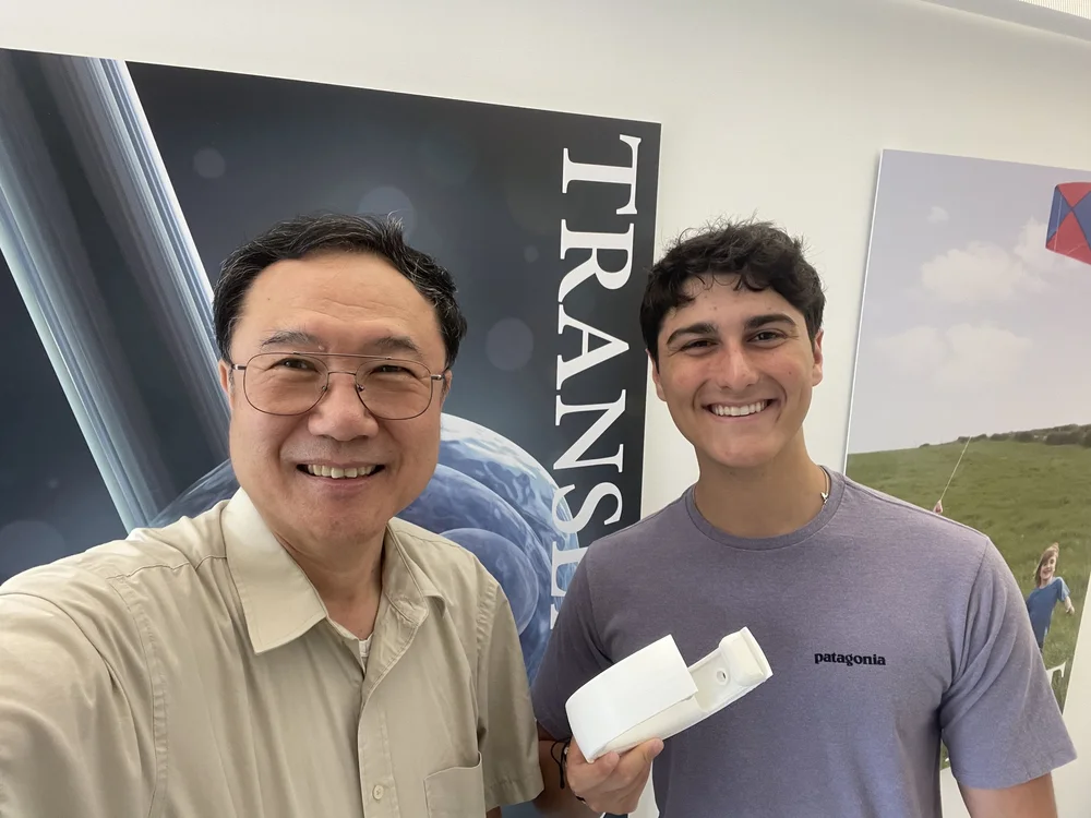 With Professor Qin and a prototype device